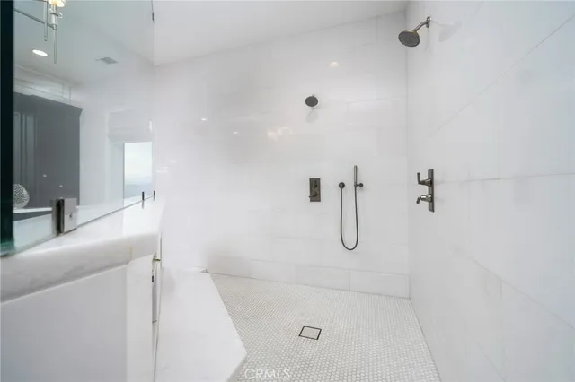 a view of a house with pool table and chairs next to a yard