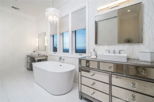 a view of a house with swimming pool and sitting area