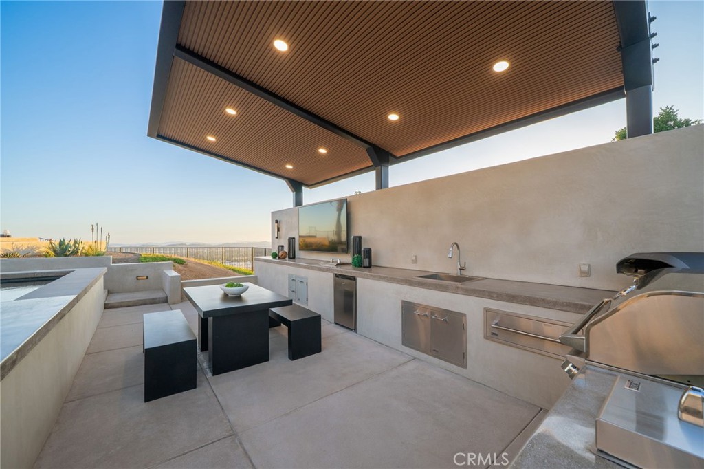 4485 Broken Spur Road La Verne, CA 91750 - Photo 57 of 75 a kitchen with stainless steel appliances granite countertop a sink and stove