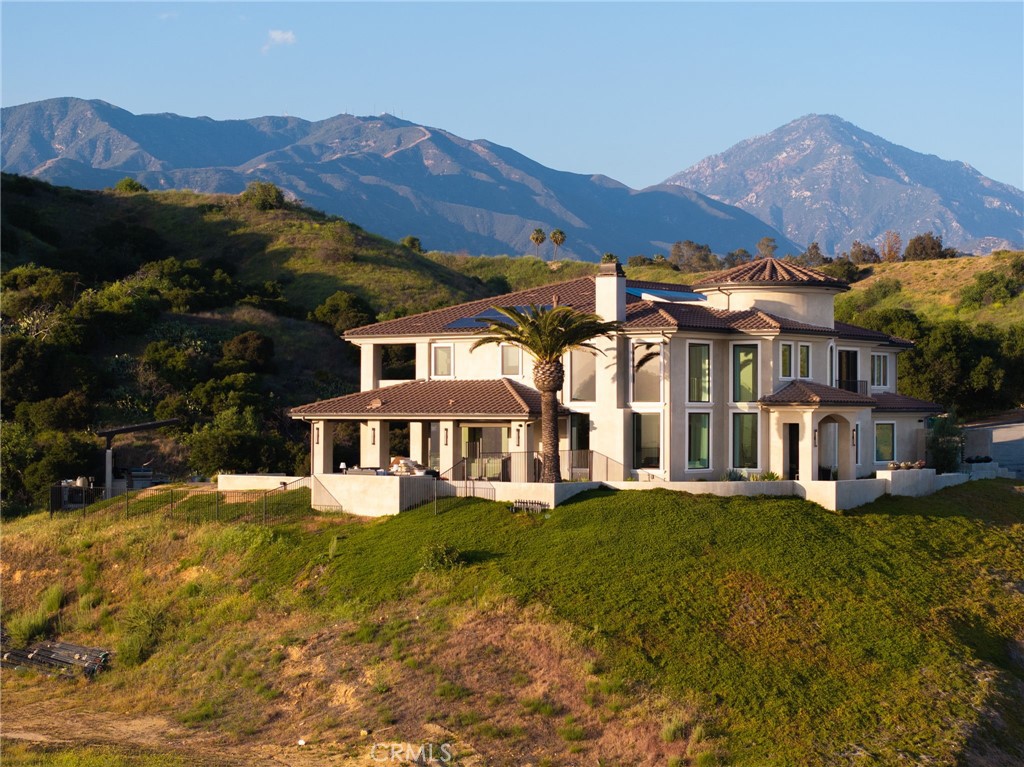 4485 Broken Spur Road La Verne, CA 91750 - Photo 75 of 75 a view of a white house with a big yard and large trees