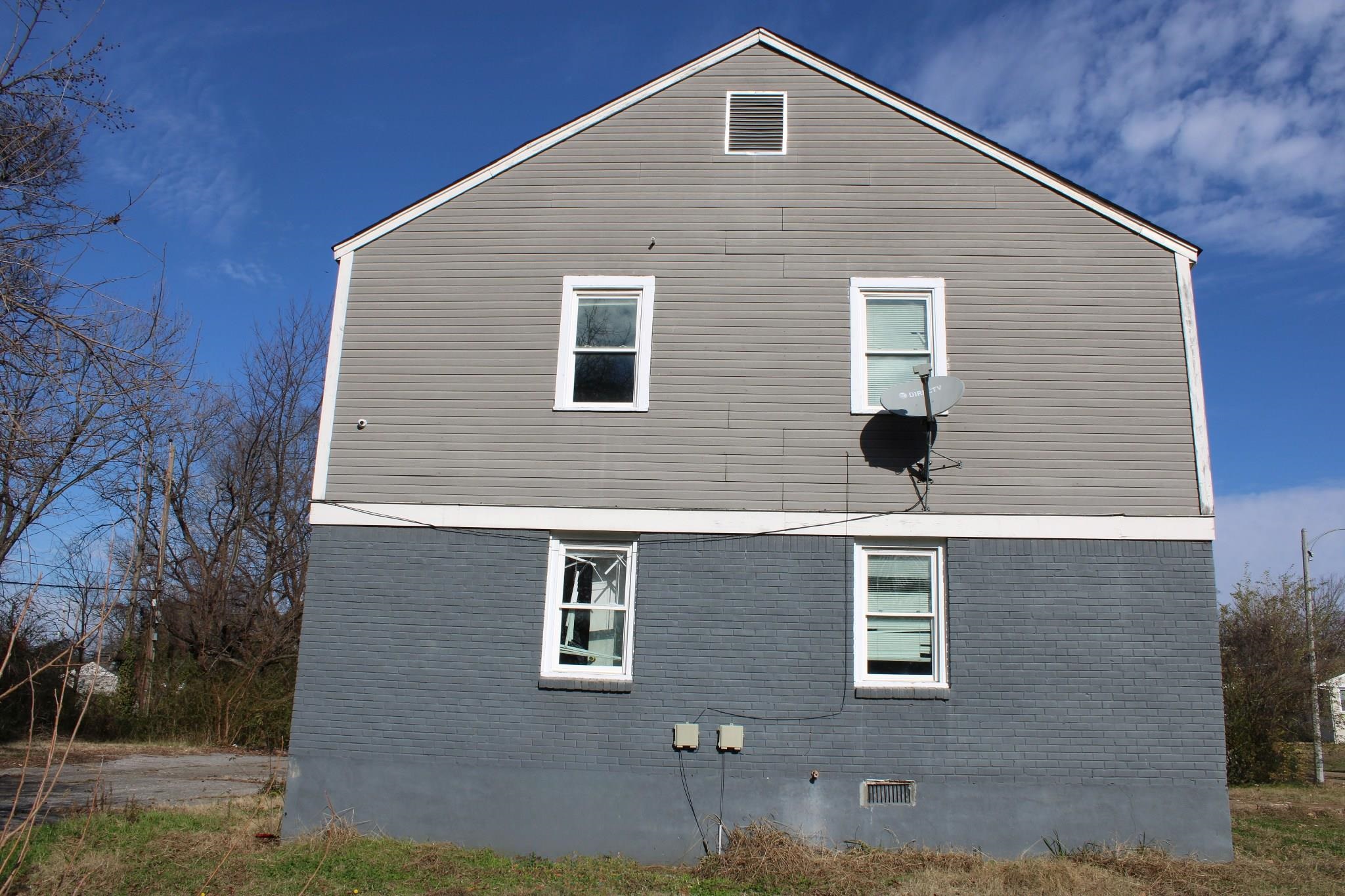 1203 Aubra Road Memphis, TN 38111 - Photo 5 of 10 View of property exterior featuring brick siding
