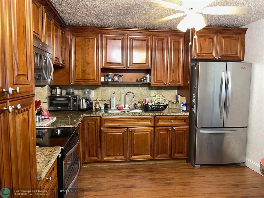 4940 East Sabal Palm Boulevard, Unit 102 Tamarac, FL 33319 - Photo 1 of 13