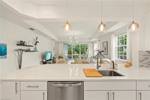 a kitchen with a sink and a refrigerator