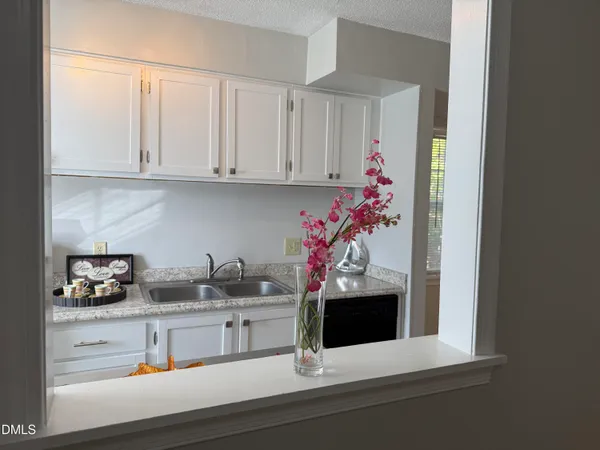 a kitchen with a microwave and cabinets