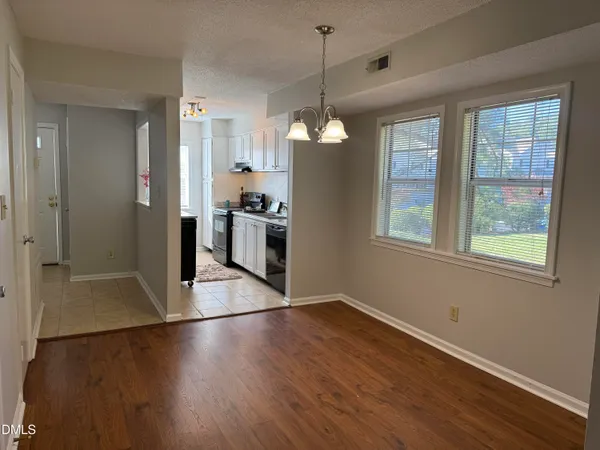 a view of a livingroom with wooden floor