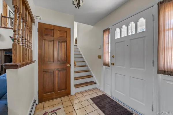 a view of a hallway with entryway door