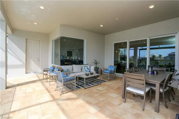 a living room with furniture and large window