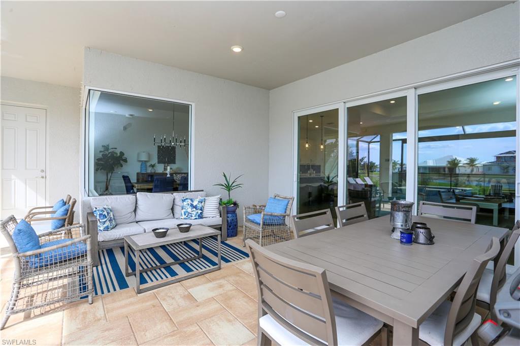 14656 Kelson Circle Naples, FL 34114 - Photo 13 of 50 a living room with furniture large window and table