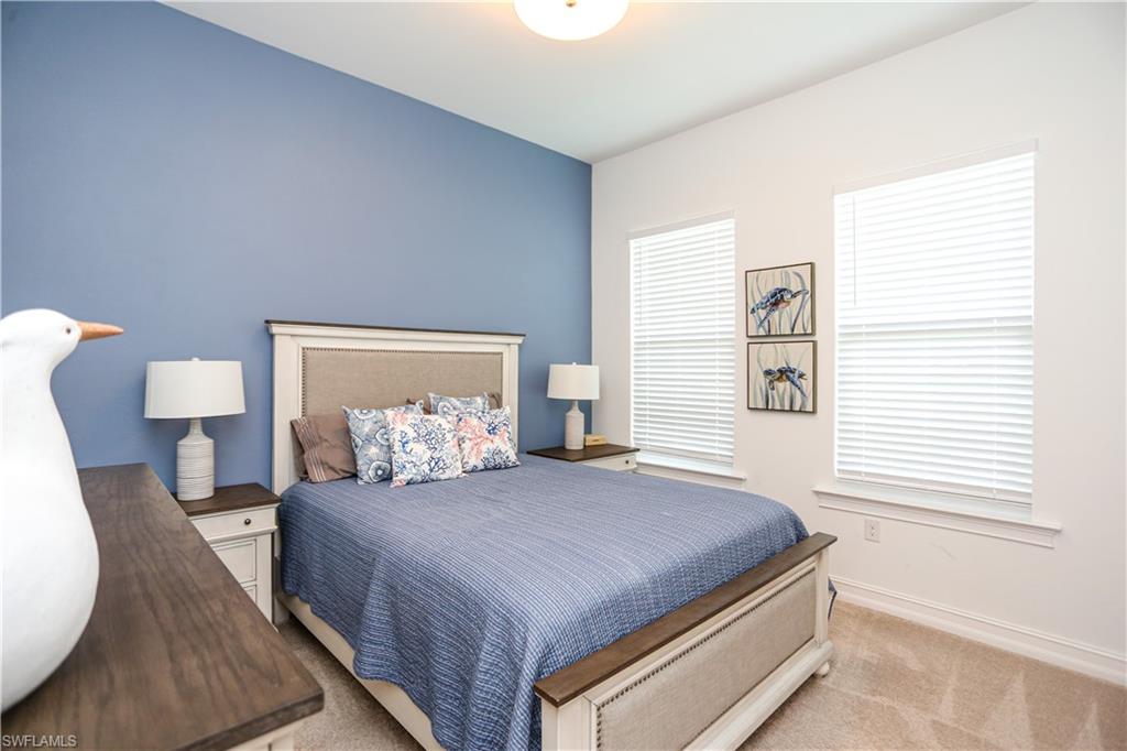 14656 Kelson Circle Naples, FL 34114 - Photo 19 of 50 a bedroom with a bed and window