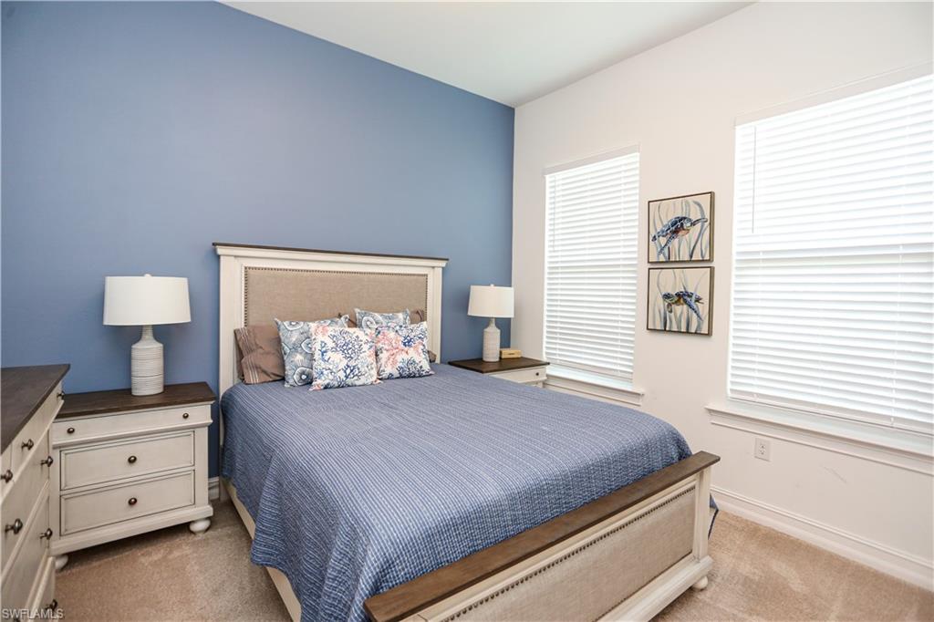 14656 Kelson Circle Naples, FL 34114 - Photo 20 of 50 a bedroom with a bed and a window
