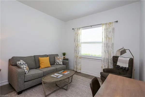 a living room with furniture and a window