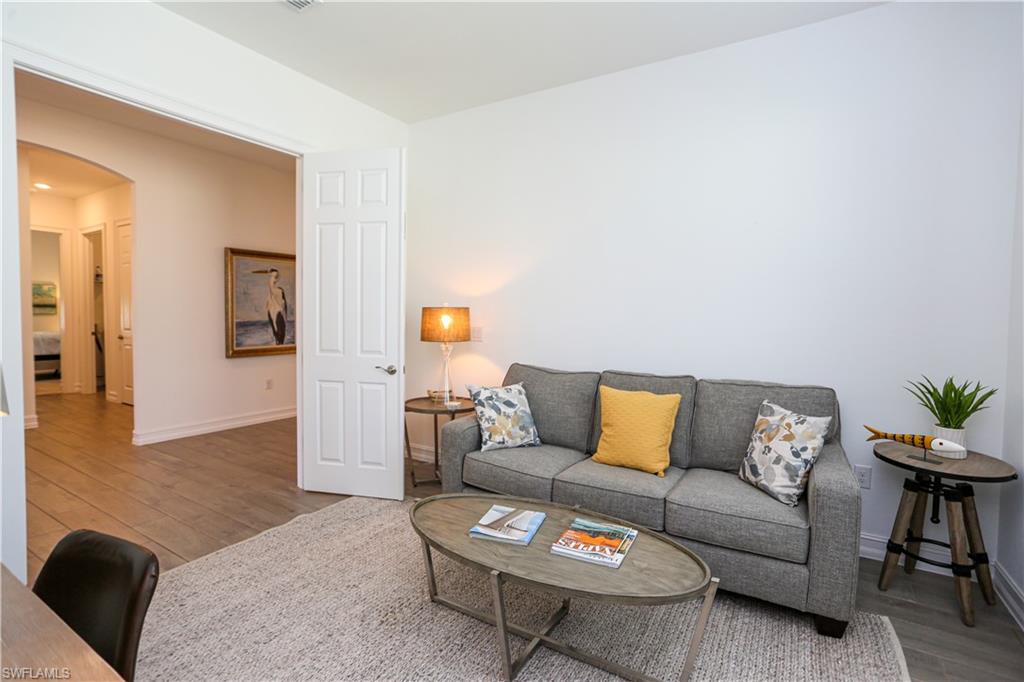 14656 Kelson Circle Naples, FL 34114 - Photo 24 of 50 a living room with furniture and a couch