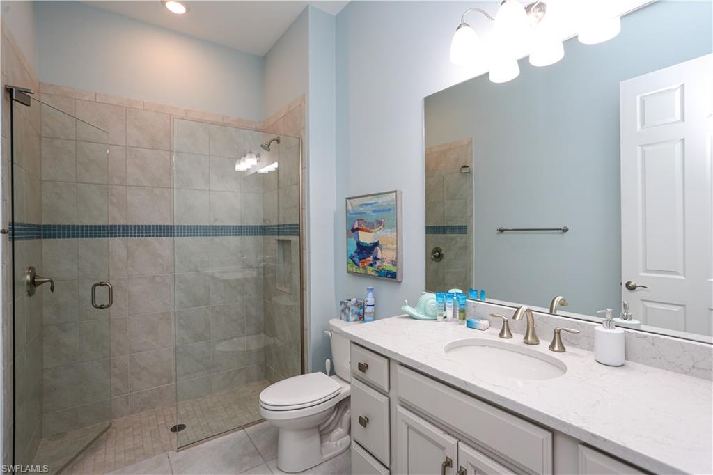 14656 Kelson Circle Naples, FL 34114 - Photo 30 of 50 a bathroom with a sink a toilet and shower