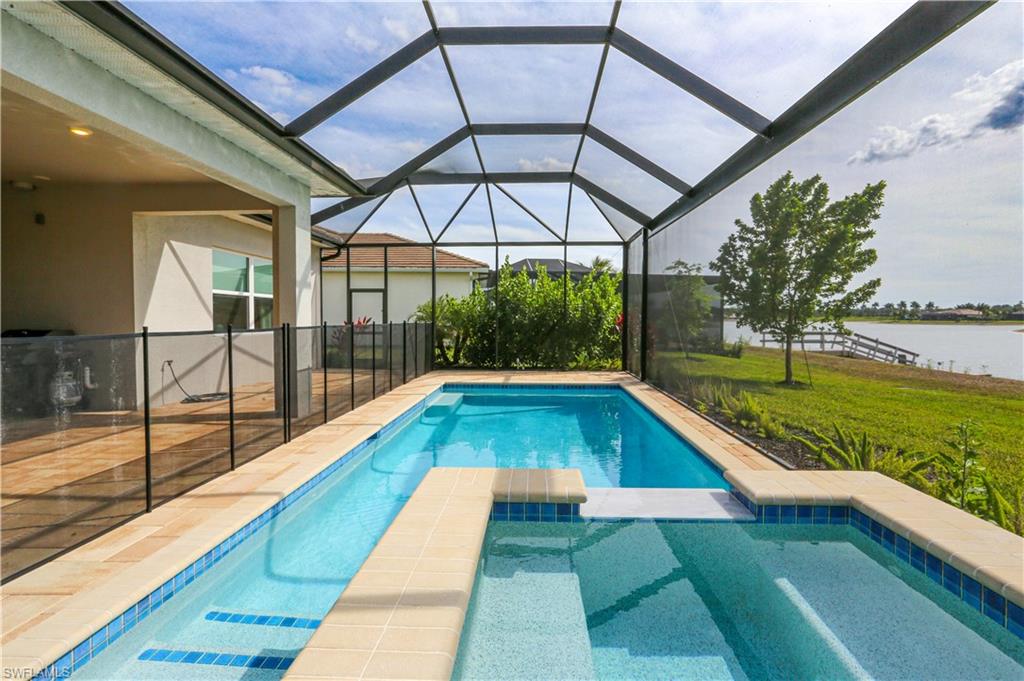 14656 Kelson Circle Naples, FL 34114 - Photo 9 of 50 a view of swimming pool with a lounge chairs