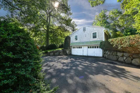 a view of a house with a yard and garage