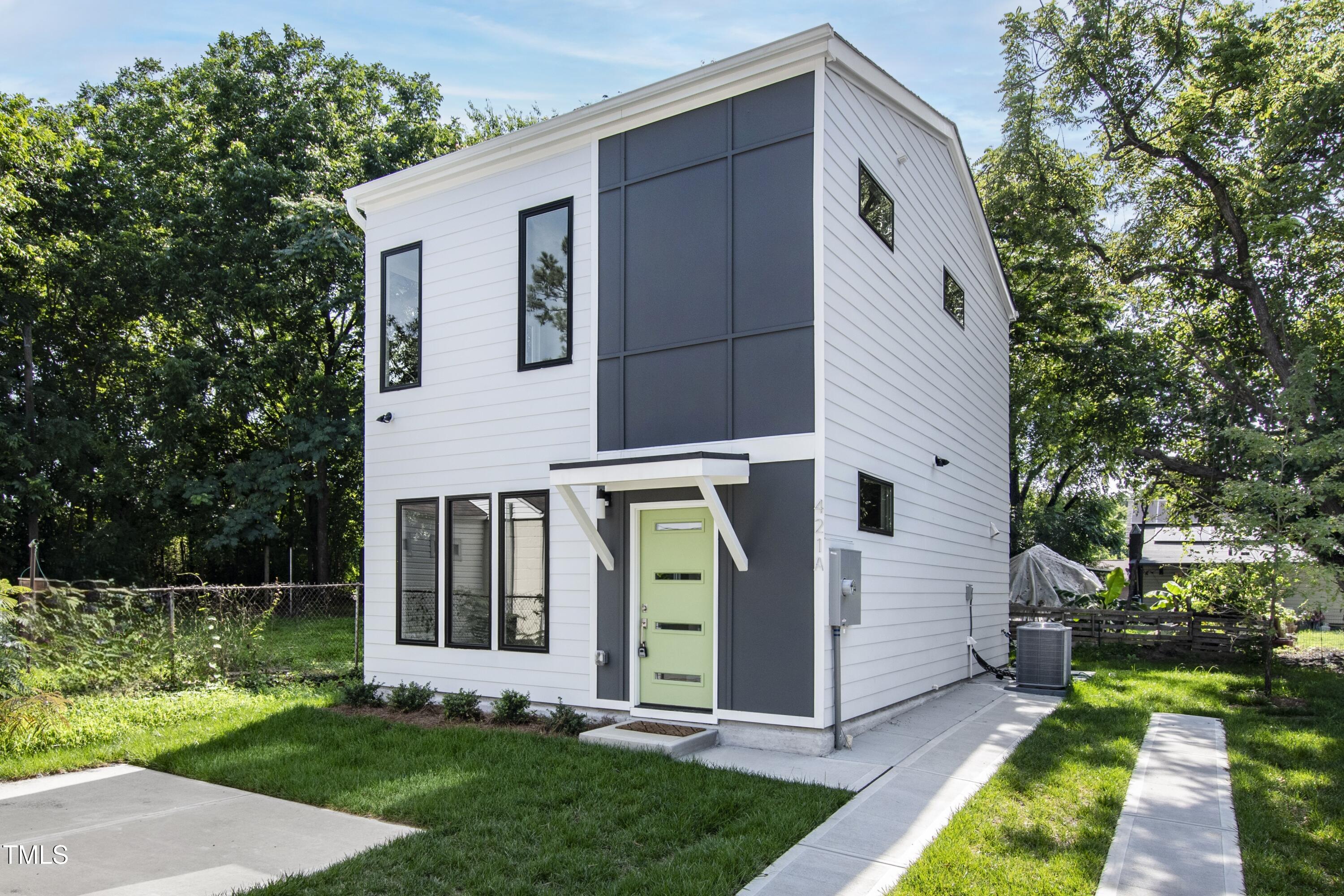 421 Eugene Street, Unit A Durham, NC 27701 - Photo 1 of 38 a front view of a house with garden