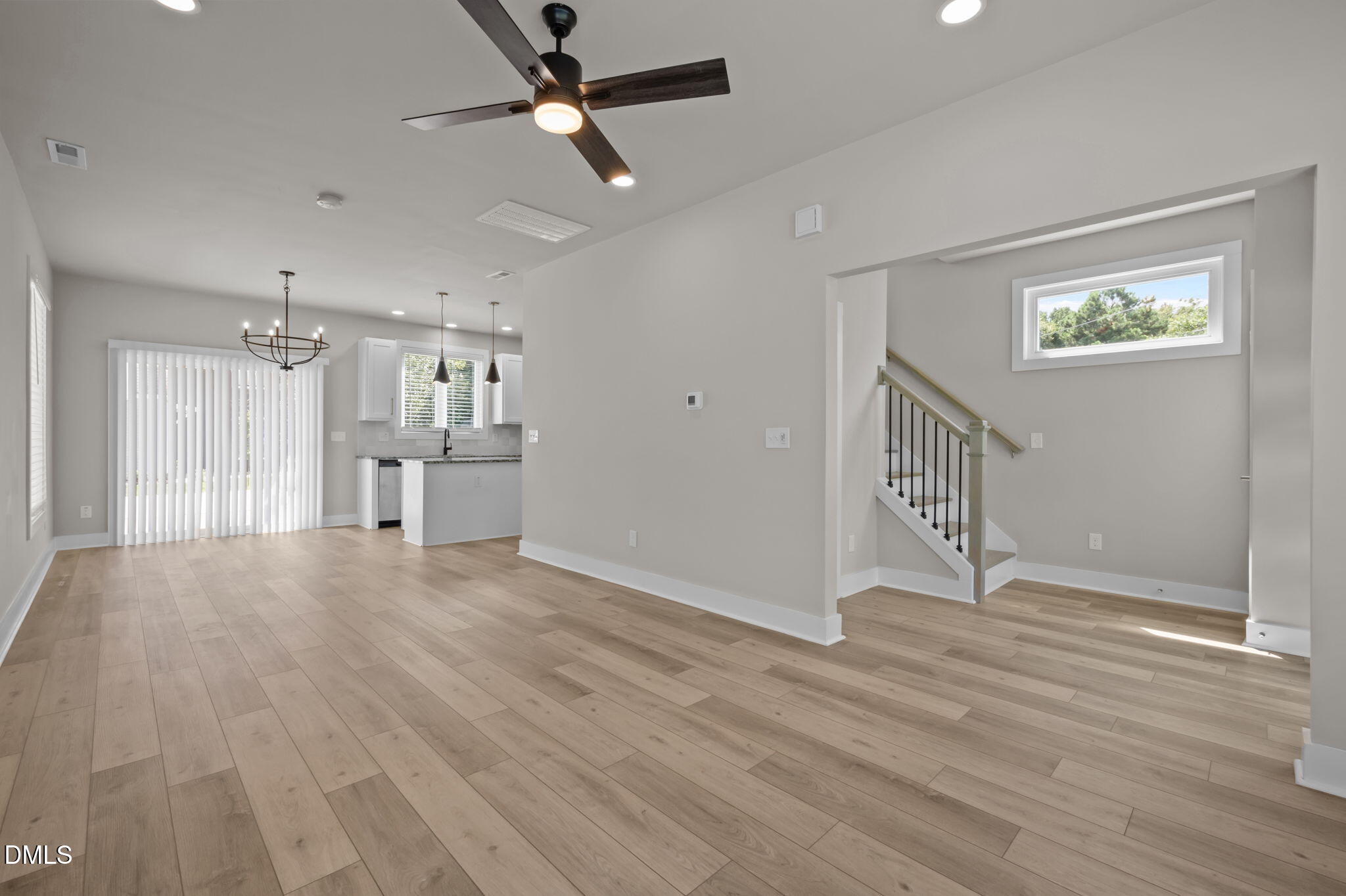 421 Eugene Street, Unit A Durham, NC 27701 - Photo 11 of 38 a view of empty room with wooden floor and ceiling fan