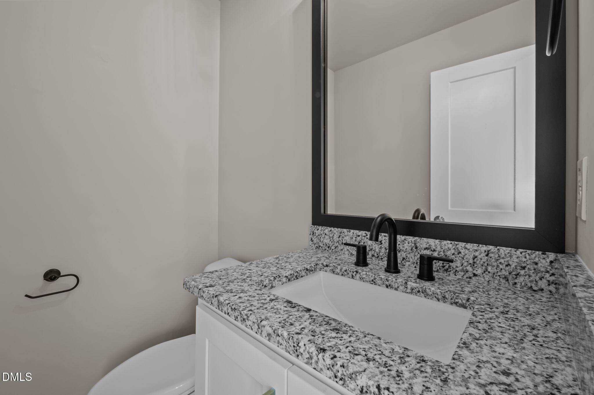 421 Eugene Street, Unit A Durham, NC 27701 - Photo 22 of 38 a bathroom with a granite countertop sink and a mirror