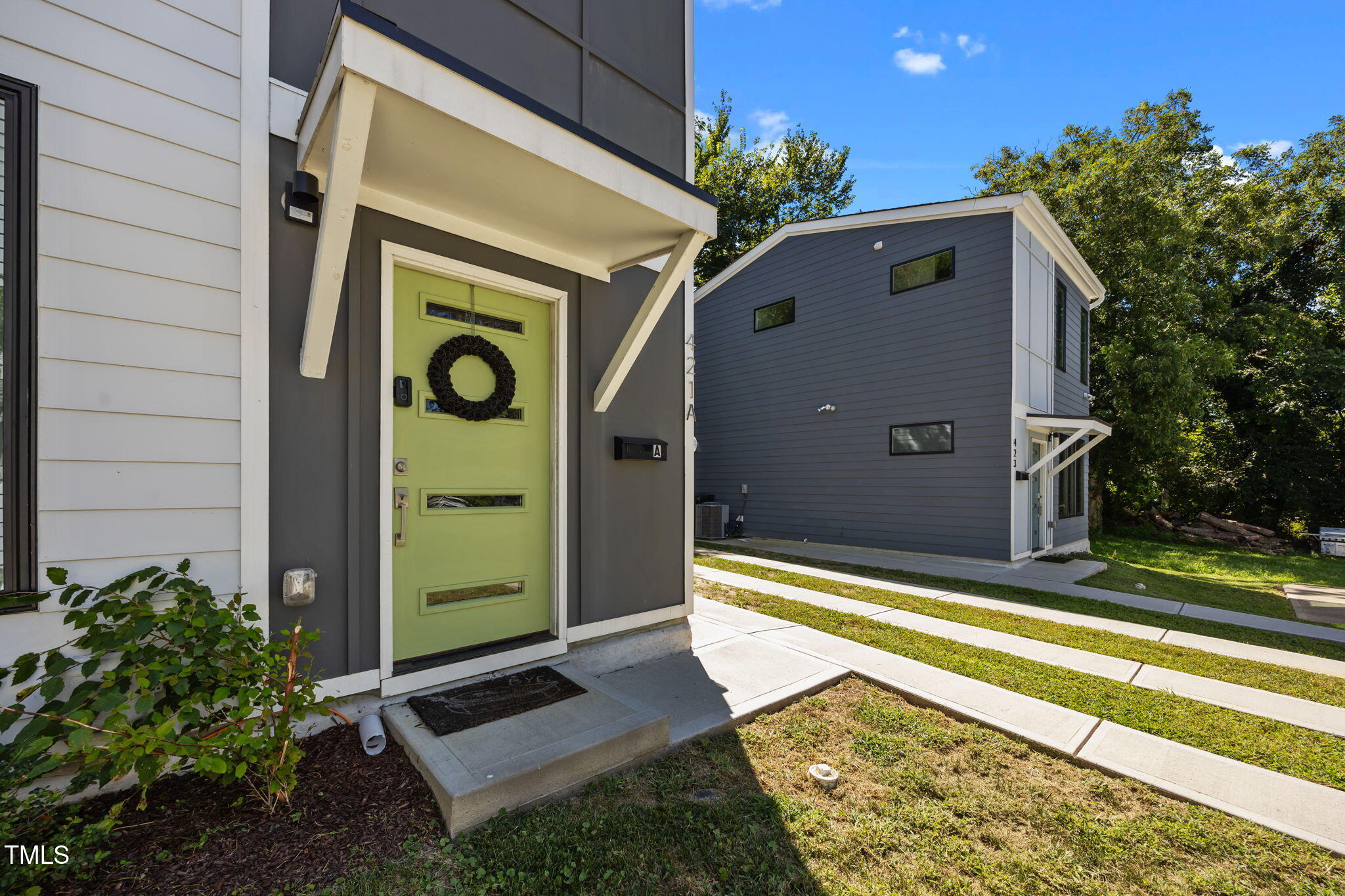 421 Eugene Street, Unit A Durham, NC 27701 - Photo 2 of 38 a front view of a house with a yard