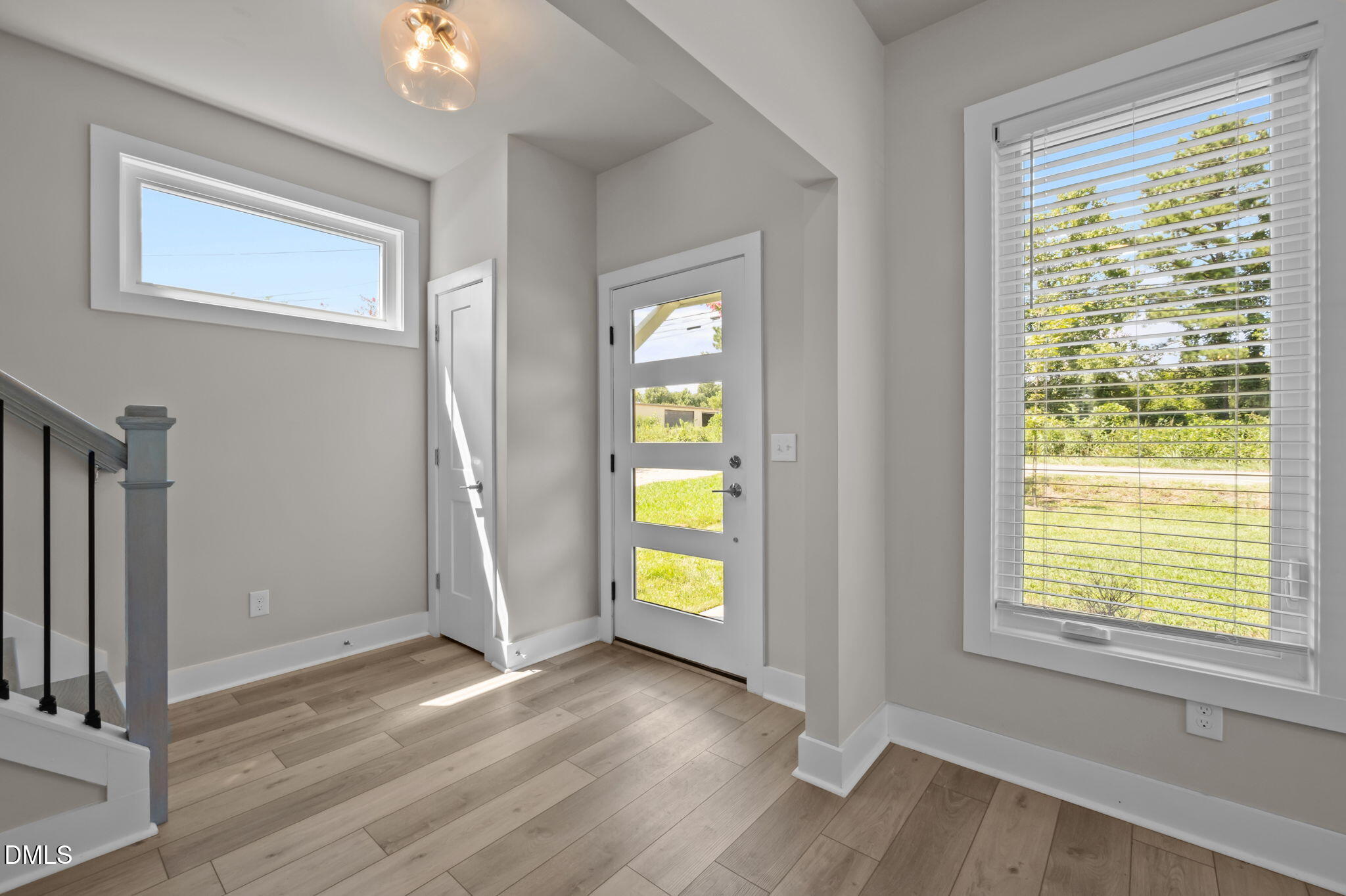 421 Eugene Street, Unit A Durham, NC 27701 - Photo 9 of 38 a view of an empty room with window and wooden floor