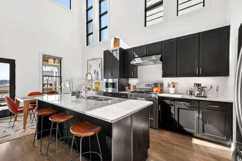 a hallway with a view of living room