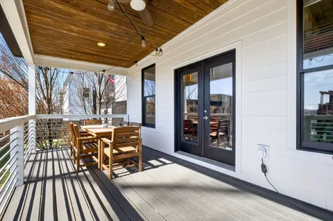 a view of walk in closet with clothes