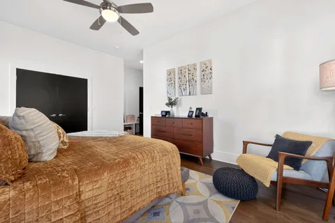 a bathroom with a double vanity sink mirror and toilet