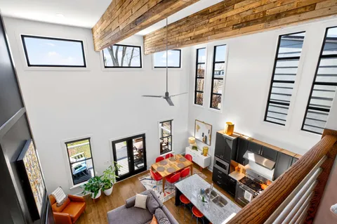 a front view of a residential apartment building with a yard