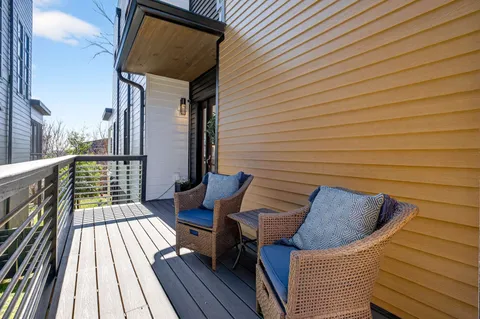 a view of entryway with livingroom and wooden floor