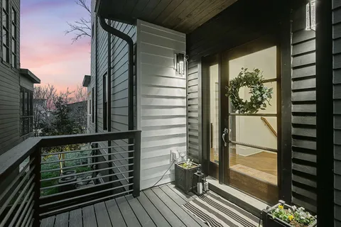 a living room with furniture a rug and a fireplace