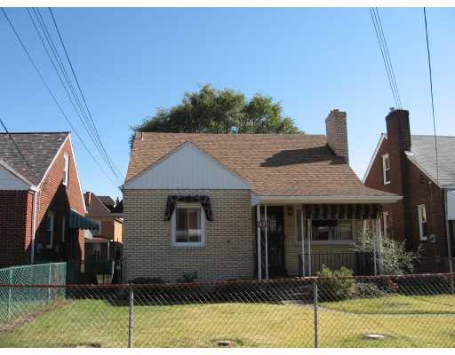 Exterior Front. Brick Cape Cod
