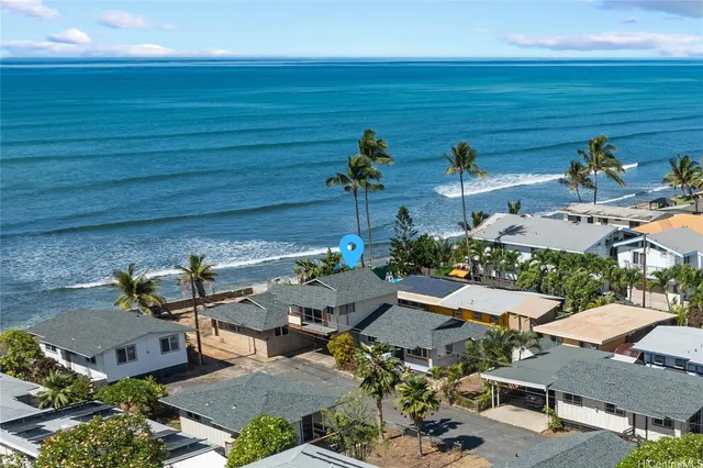 an aerial view of a house with outdoor space
