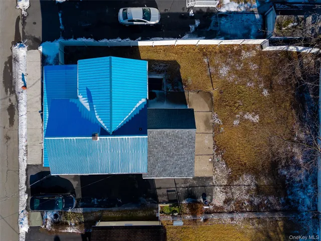a buildings covered with tall trees