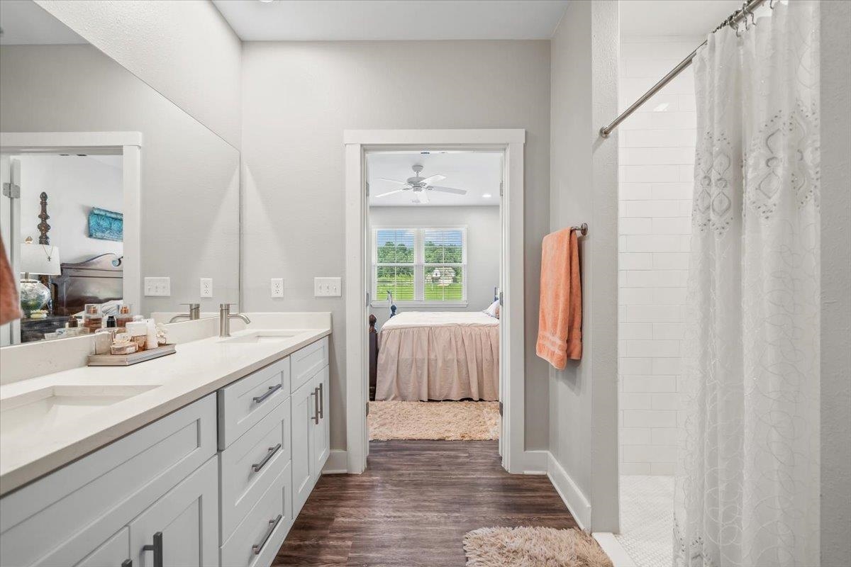 415 Abbey Road, Unit D Munford, TN 38058 - Photo 19 of 35 Bathroom featuring a double vanity with light gray cabinetry, light-colored countertops, and brushed nickel fixtures