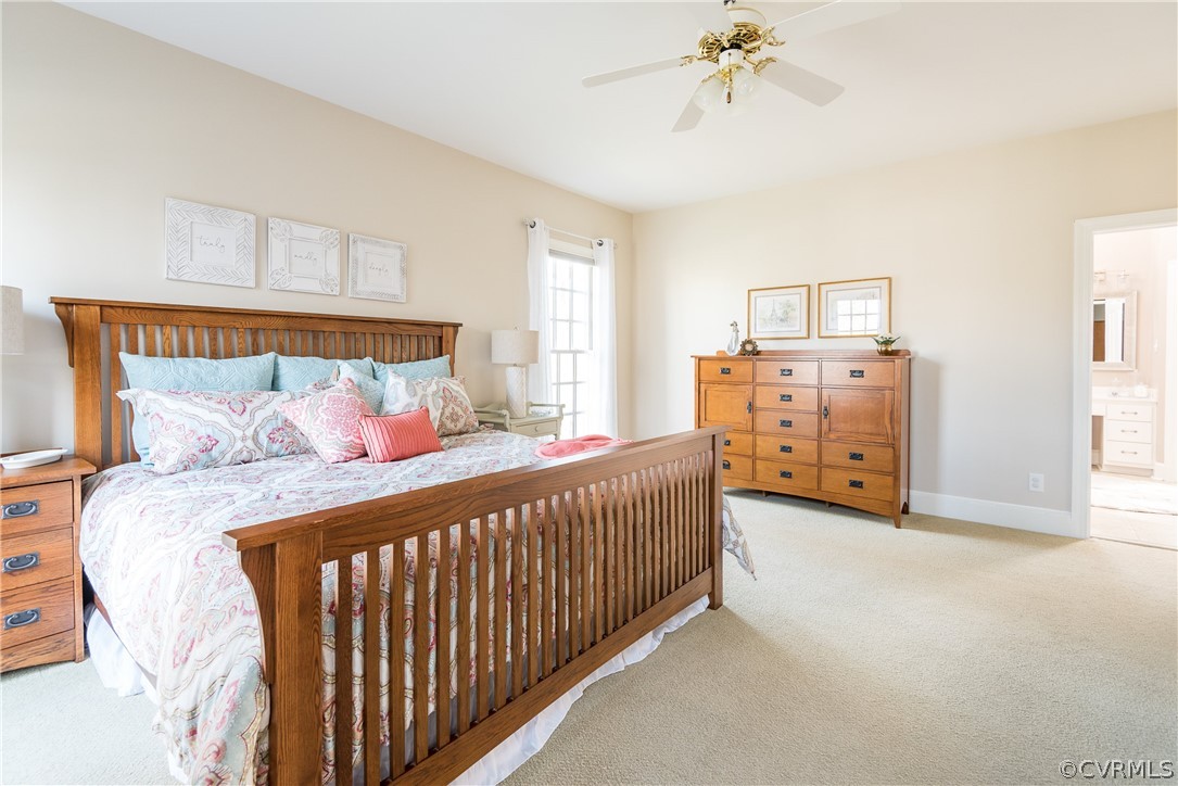 5201 Clipper Cove Road Midlothian, VA 23112 - Photo 20 of 49 a bedroom with a bed and a chandelier