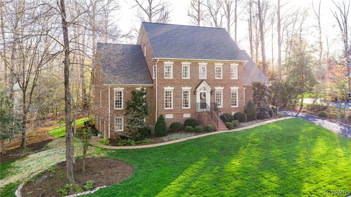 5201 Clipper Cove Road Midlothian, VA 23112 - Photo 3 of 49 a front view of a house with garden