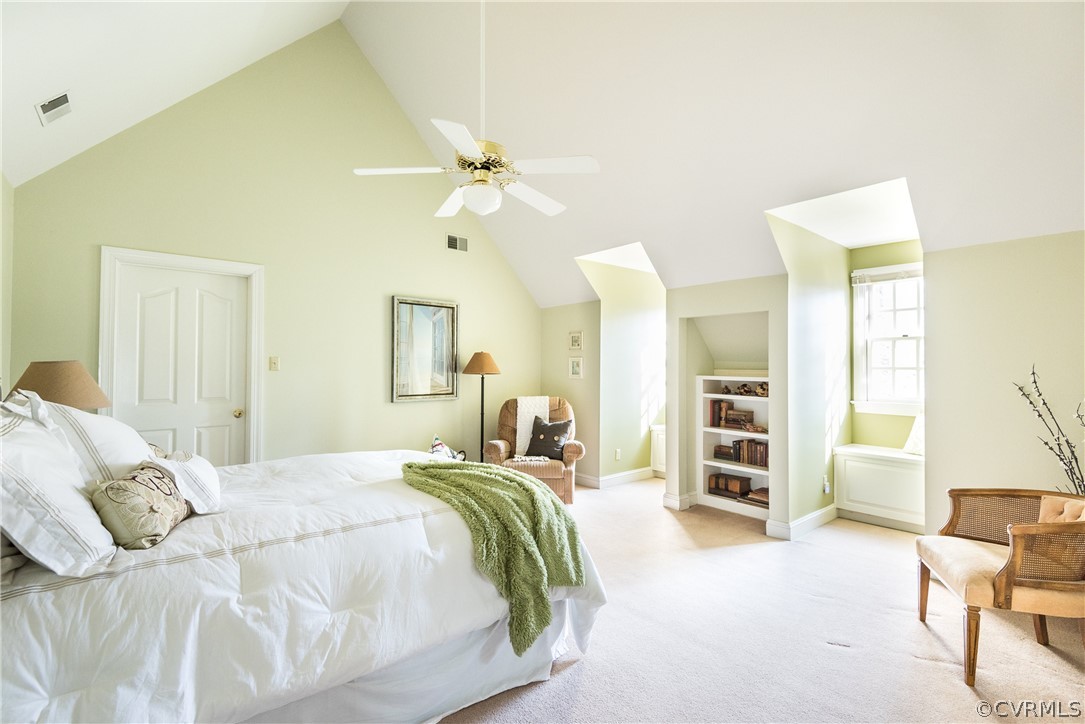 5201 Clipper Cove Road Midlothian, VA 23112 - Photo 31 of 49 a bedroom with a large bed and a chandelier