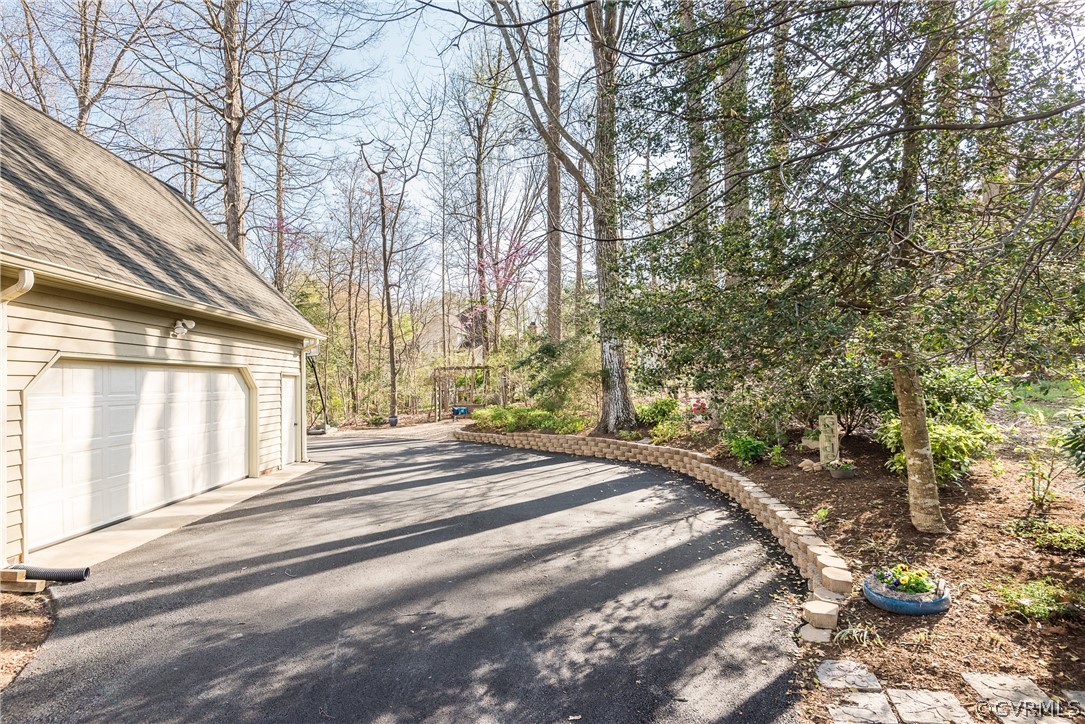 5201 Clipper Cove Road Midlothian, VA 23112 - Photo 42 of 49 a view of a yard with large trees