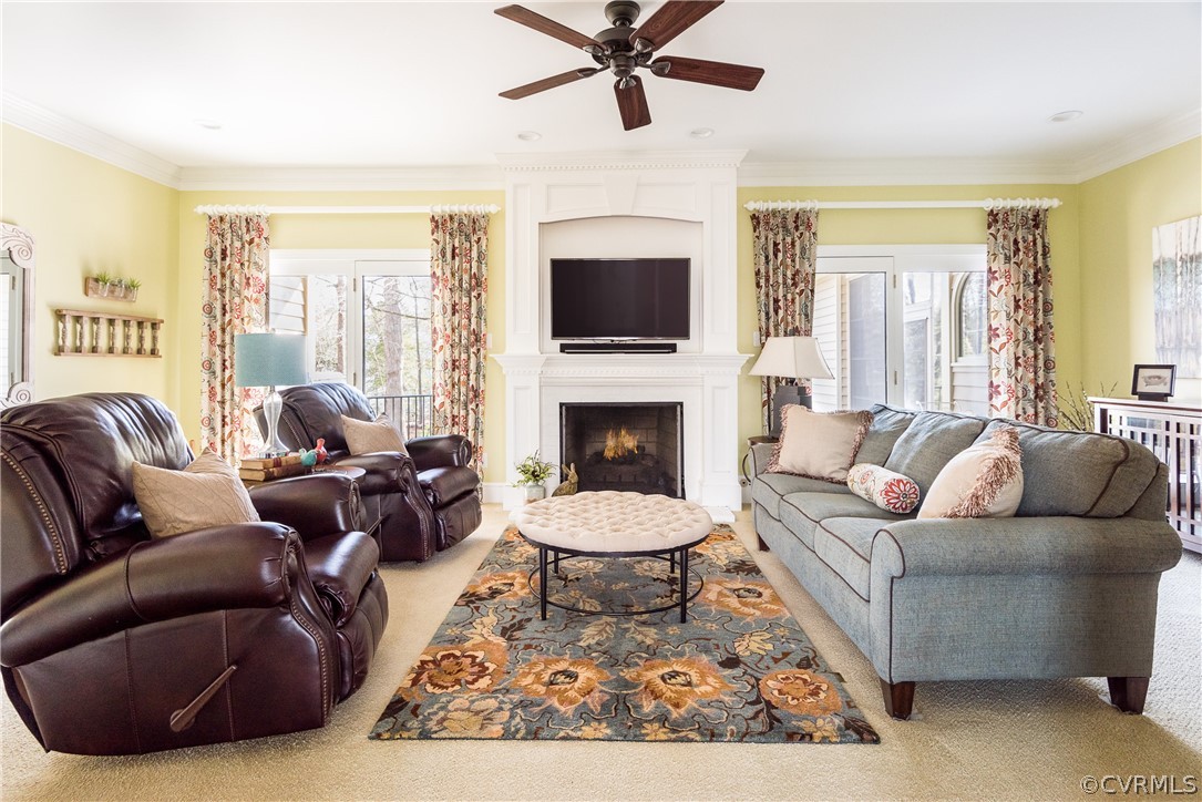 5201 Clipper Cove Road Midlothian, VA 23112 - Photo 9 of 49 a living room with furniture a flat screen tv and a fireplace