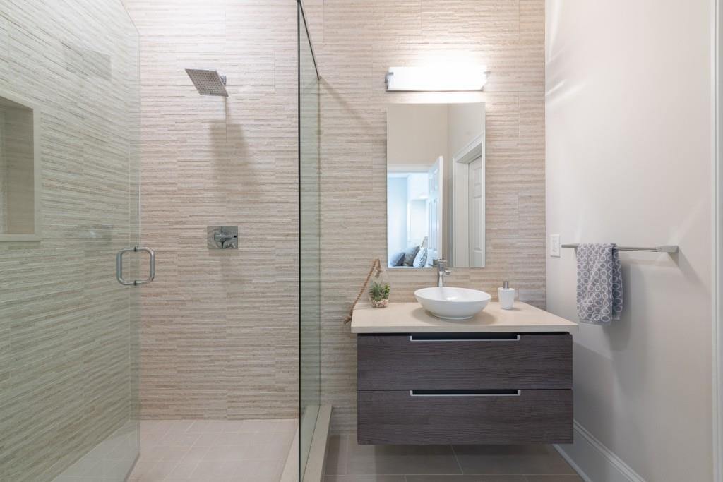 165 Autry Trail Alpharetta, GA 30022 - Photo 55 of 70 a bathroom with a sink and a mirror