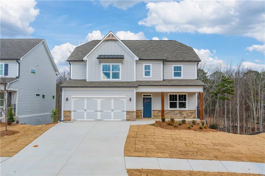126 Spaulding Lane Woodstock, GA 30188 - Photo 1 of 48 a front view of a house with a yard