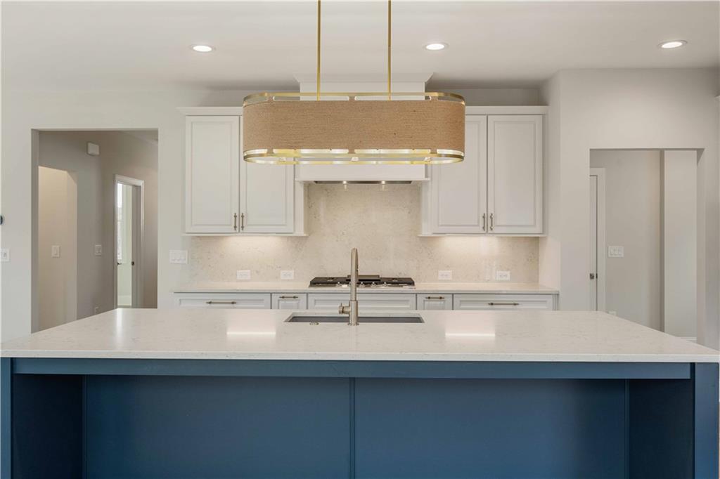 126 Spaulding Lane Woodstock, GA 30188 - Photo 11 of 48 a kitchen with a sink a counter space and cabinets