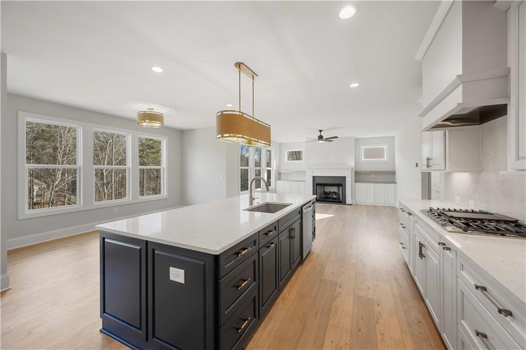 126 Spaulding Lane Woodstock, GA 30188 - Photo 14 of 48 a kitchen with granite countertop a stove and a sink