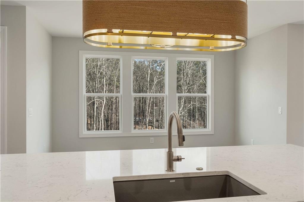 126 Spaulding Lane Woodstock, GA 30188 - Photo 15 of 48 a kitchen with a sink and a window