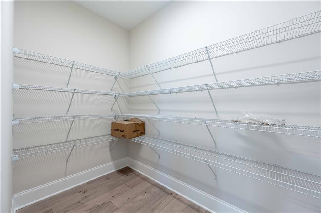 126 Spaulding Lane Woodstock, GA 30188 - Photo 18 of 48 a view of a room with racks on the wall