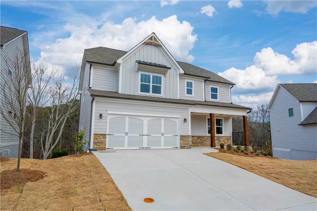 126 Spaulding Lane Woodstock, GA 30188 - Photo 2 of 48 a front view of a house with a yard