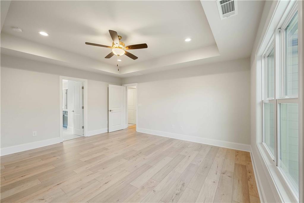 126 Spaulding Lane Woodstock, GA 30188 - Photo 23 of 48 wooden floor in an empty room with a window