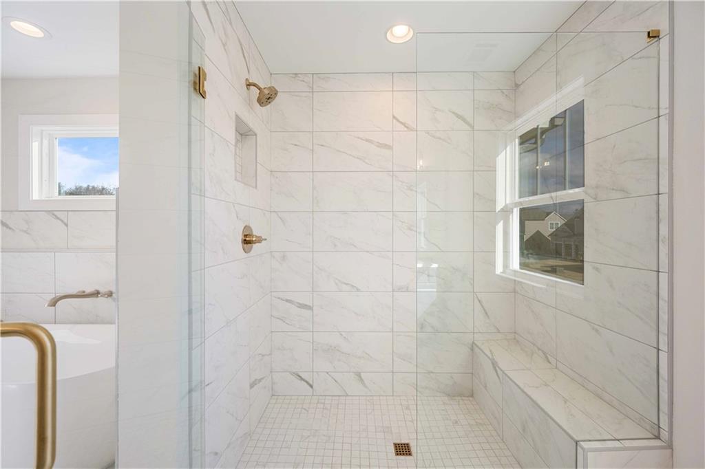 126 Spaulding Lane Woodstock, GA 30188 - Photo 26 of 48 a bathroom with a shower