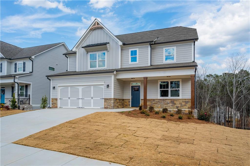 126 Spaulding Lane Woodstock, GA 30188 - Photo 3 of 48 a house view with a outdoor space
