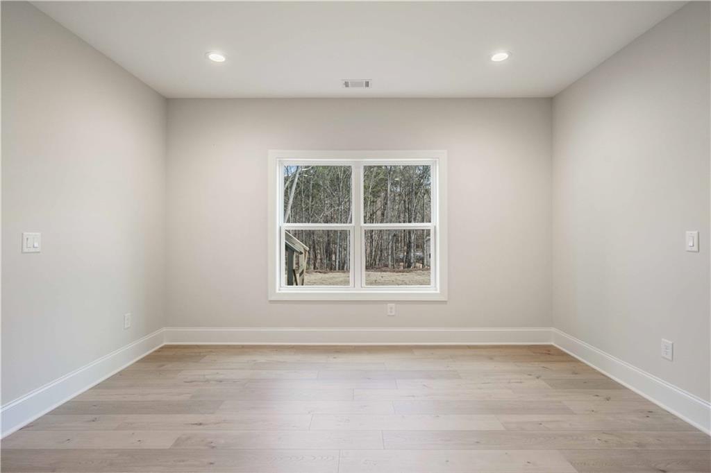 126 Spaulding Lane Woodstock, GA 30188 - Photo 36 of 48 an empty room with a window